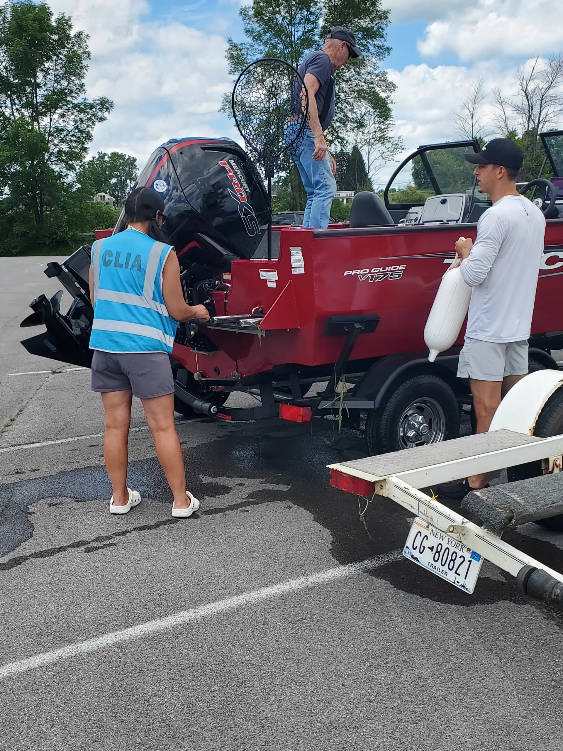 Boat steward assisting boater